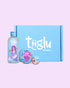 Tiiglu® Mermaid Glow Gift Set: A magical trio for kids featuring a pink-haired mermaid—Mermaid Body Wash (95% natural), Body Crème (98% natural), and strawberry pink Lip & Cheek Tint (98% natural). Vegan, cruelty-free, in eco-friendly packaging, presented in a blue Tiiglu® gift box.