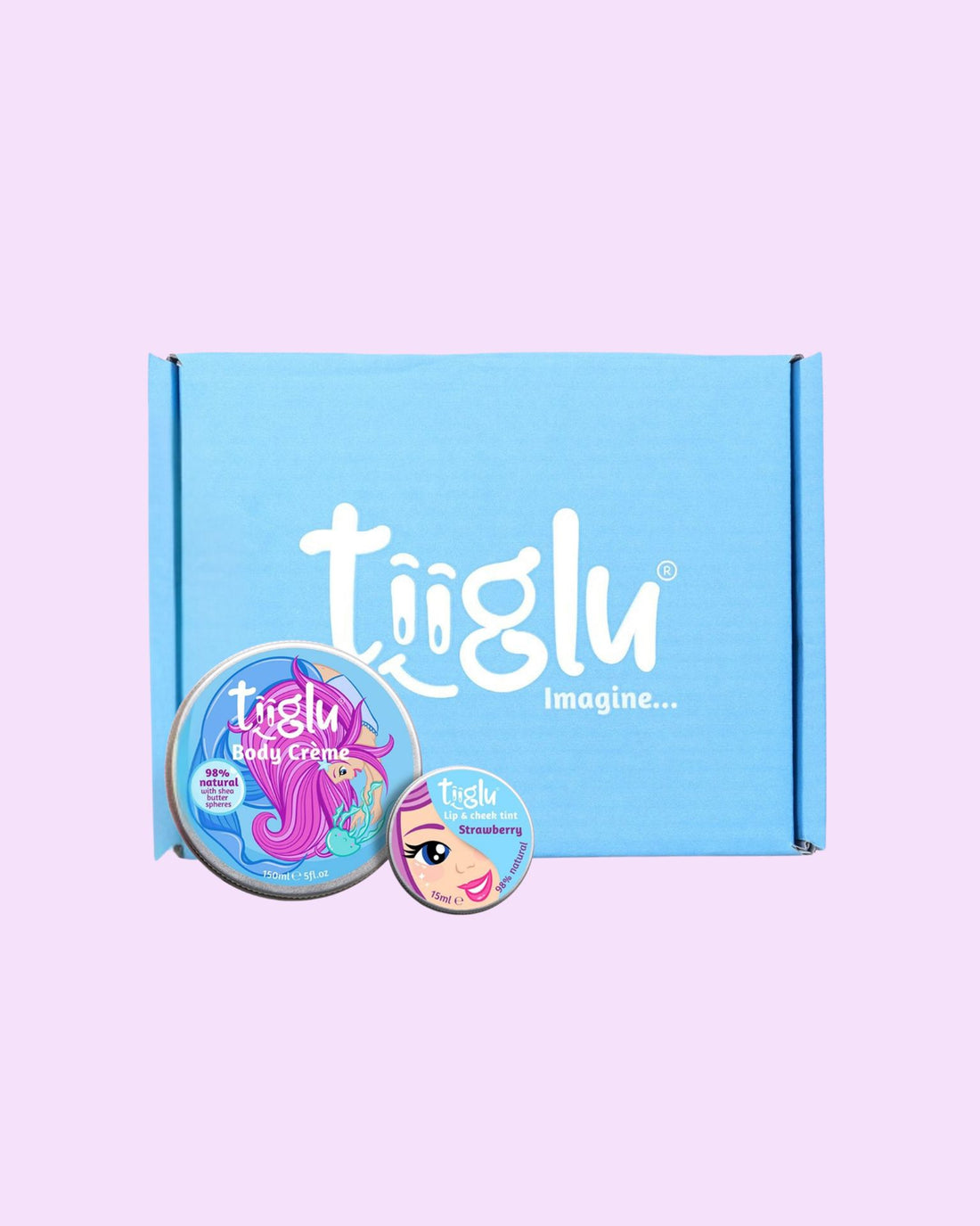 Tiiglu® Kids Mermaid Twinkle Gift Set with Body Crème (150ml) and Lip &amp; Cheek Tint (15ml), both 98% natural, featuring a pink-haired mermaid and face on light blue labels, in a blue Tiiglu® gift box, on a light pink background.