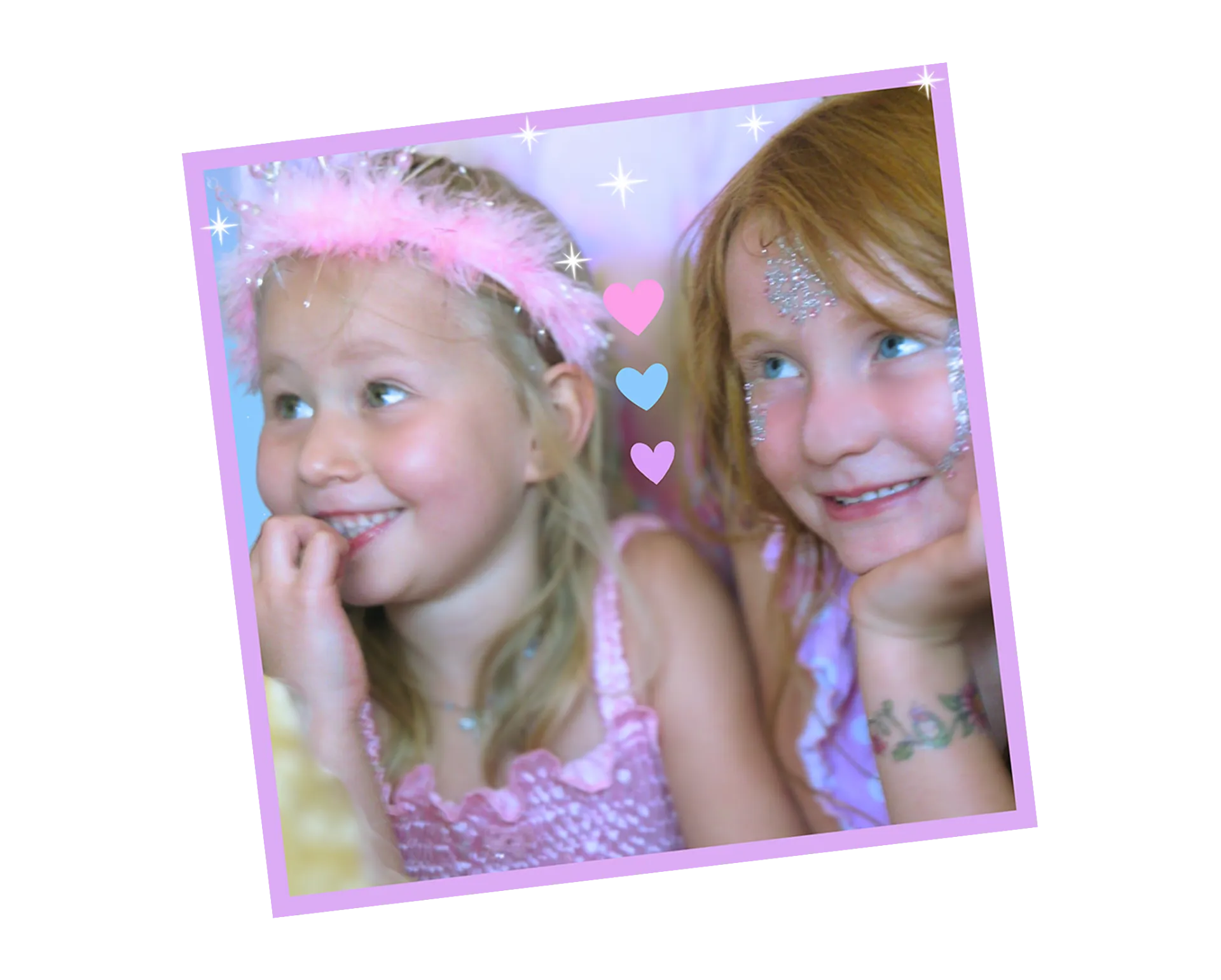 Two girls in sparkly pink outfits, one with a pink feathered headband and the other with glittery face stickers, pose against a pastel background with heart and star graphics. This Our Story page image is next to the heading "Imagination is a Superpower